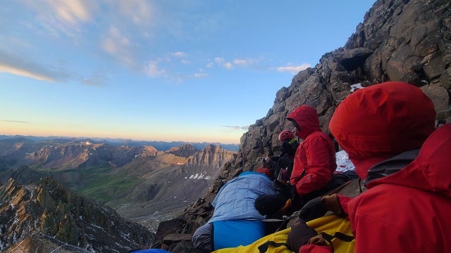Sneffels-Rescue-pic4-rescuers-and-patient-watching-sunrise-Ouray-Mtn-Rescue-Team-on-FB.jpg 