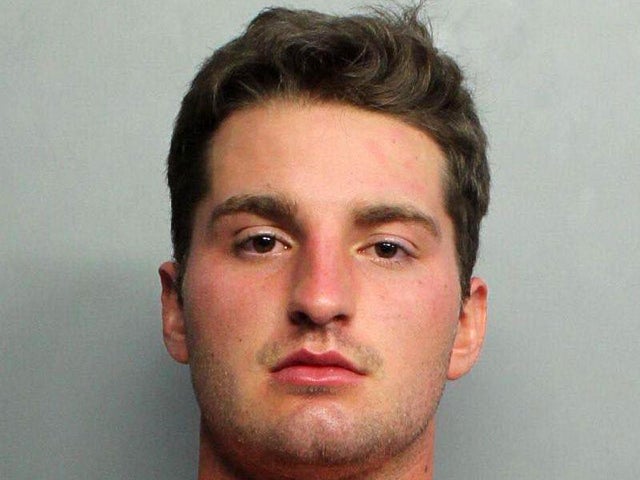 Maxwell Berry is seen in a police booking photo. 