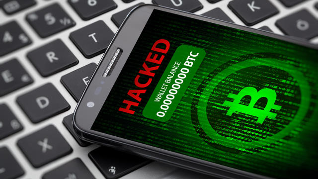 bitcoin wallet hacked message on smart phone screen. 