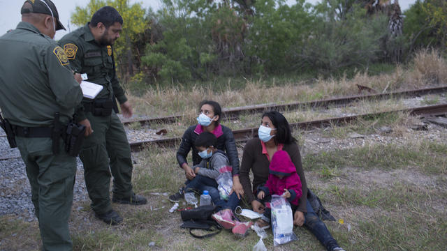 Refugee families cross into the United States along the Mexican Border 