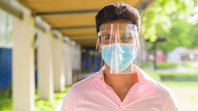 man wearing face shield 