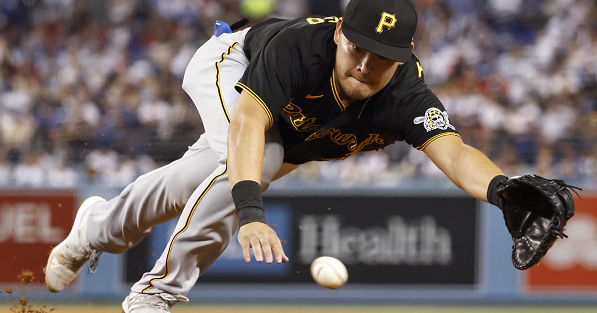 Pittsburgh Pirates third baseman Ke'Bryan Hayes fields a ball hit by Los  Angeles Dodgers' Justin Turner before throwing him out at first during the  third inning of a baseball game Tuesday, May