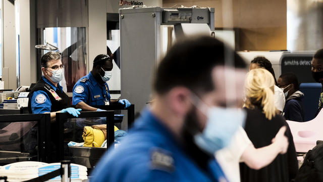 Travelers At Detroit Metro Airport As TSA Experiences Staff Shortages 