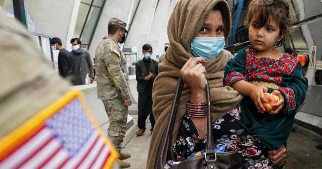 As Taliban forms new government, U.S. works to process Afghan refugees in Doha, Qatar - CBS News