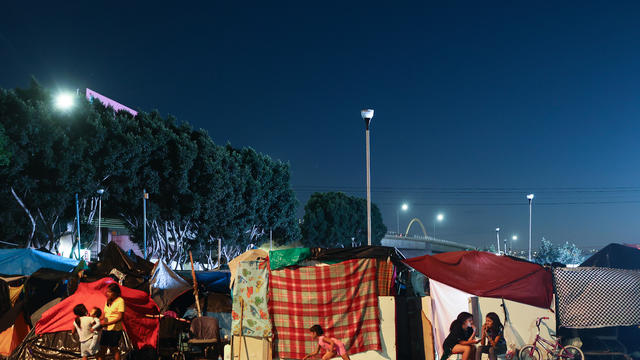 Migrants Huddle In Camps And Shelters In Tijuana Waiting To Cross Into U.S. 