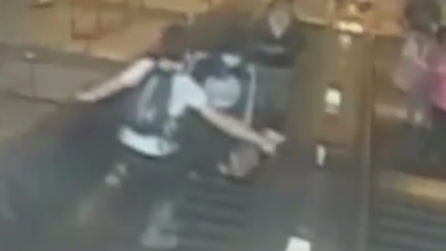 bk-woman-kicked-down-escalator.png 