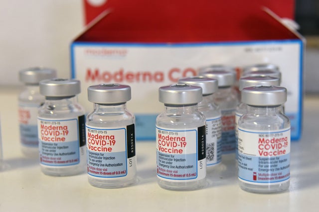 Moderna COVID-19 vaccine vials seen on a table 