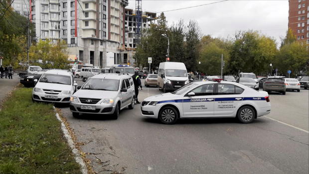 Police block the road near the scene of a shooting at university in Perm 