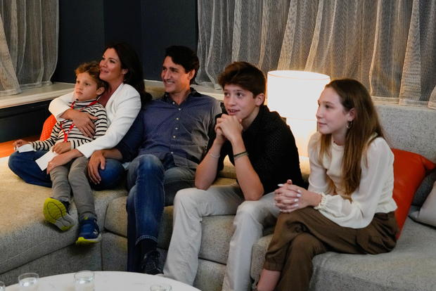 Canada's Liberal Prime Minister Justin Trudeau, accompanied by his wife Sophie Gregoire and his children Ella-Grace, Xavier and Hadrien watch the election coverage on a TV, in Montreal 