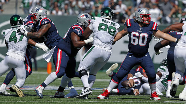 Mac Jones gets hit behind the Patriots' offensive line 