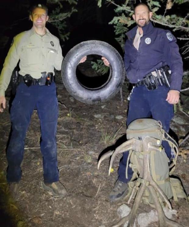 No More Tire Elk 1 ( Wildlife officers Scott Murdoch, L, and Dawson Swanson hold up tire, credit Pat Hemstreet) 