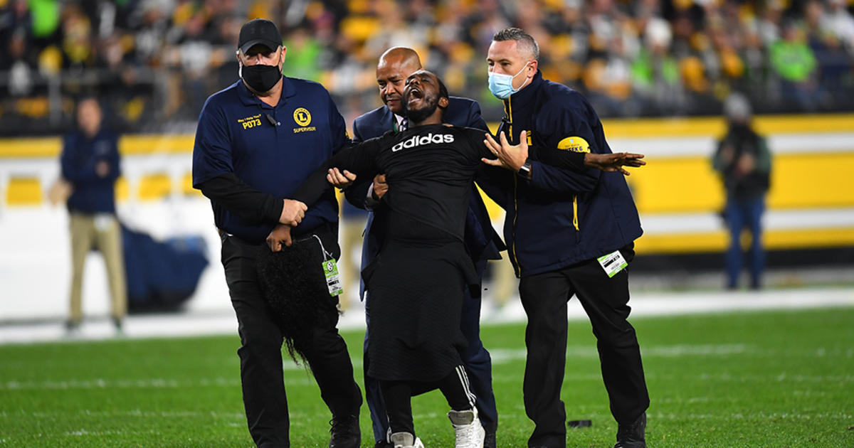 Fans wear Seattle Seahawks head gear as they watch warmups before an NFL  football game between the Pittsburgh Steelers and the Seattle Seahawks,  Sunday, Oct. 17, 2021, in Pittsburgh. (AP Photo/Fred Vuich