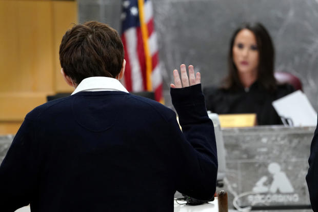 Parkland school shooter Nikolas Cruz is sworn in before pleading guilty on all four criminal counts stemming from his alleged attack on a Broward County jail guard in November 2018, in Fort Lauderdale, Florida, October 15, 2021. 