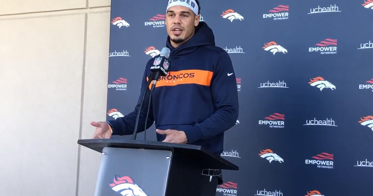 Denver Broncos free safety Justin Simmons takes off his jersey to meet  coronavirus requirements after taking part in drills at NFL football  training camp, Wednesday, July 28, 2021, in Englewood, Colo. (AP