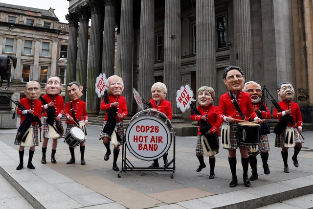 Oxfam activists protest during COP26 in Glasgow 