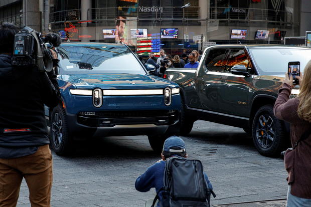 Journalists photograph a Rivian R1T pickups, the Amazon-backed electric vehicle (EV) maker, during the company's IPO outside the Nasdaq Market site in Times Square in New York 