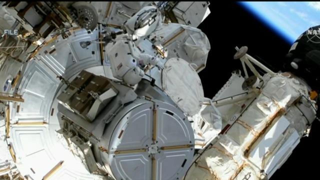 Two spacewalkers replace space station antenna after debris scare prompted delay picture