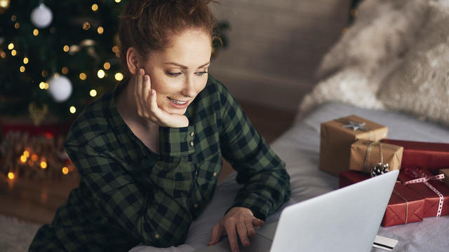 Woman shopping for Christmas presents online 