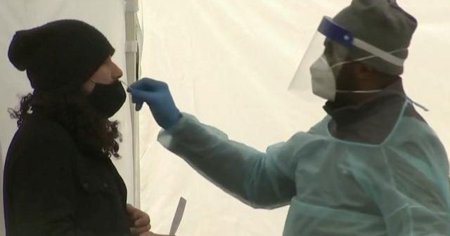 Omicron is spreading at a "staggering" rate across the country - CBS News