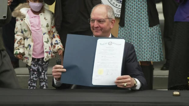 Louisiana Governor John Bel Edwards signs a posthumous pardon for Homer Plessy, 