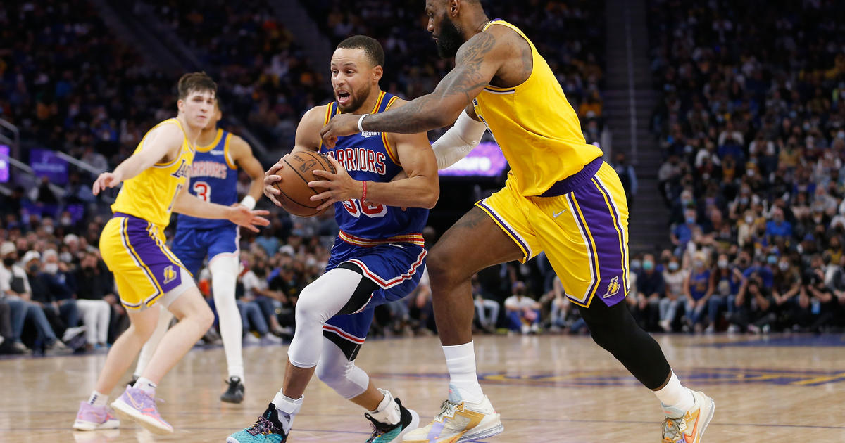 LeBron James makes history as Warriors edge Lakers 117-115