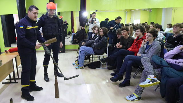 Civilian defence specialists conduct emergency preparedness training for students at a local school in Kharkiv 