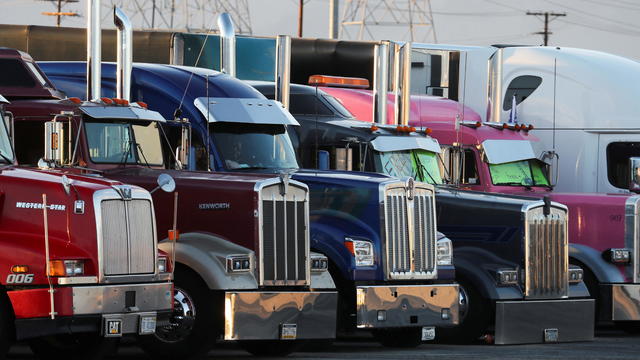Truckers and their supporters form a convoy bound for the nation's capital from California 