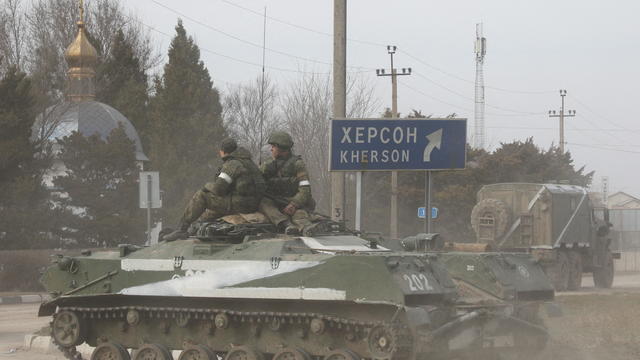 Russian Army military vehicle drives along a street in Armyansk 