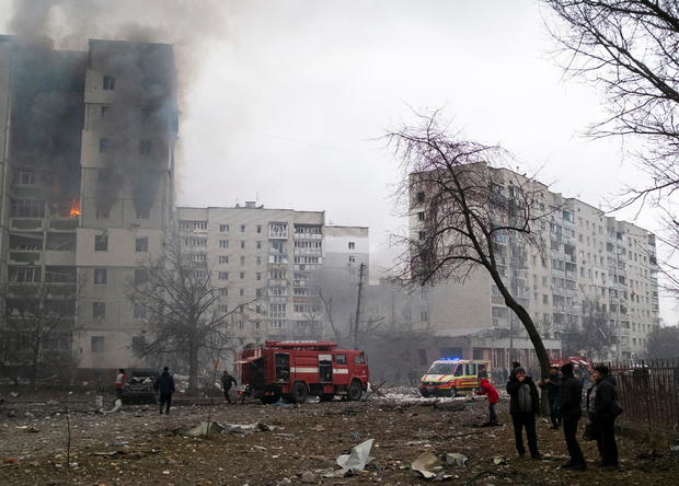 Flames and smoke billows from a residential building damaged by recent shelling in Chernihiv 