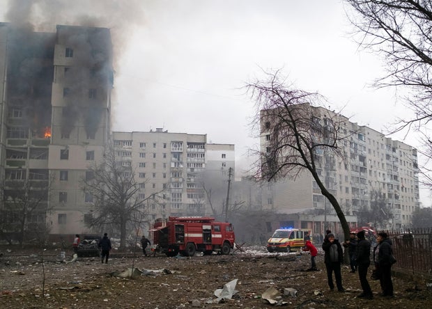 Flames and smoke billows from a residential building damaged by recent shelling in Chernihiv