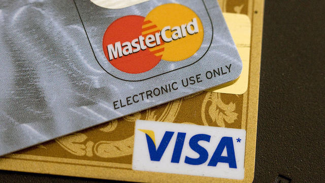 In this photo illustration there are three Mastercard Credit 