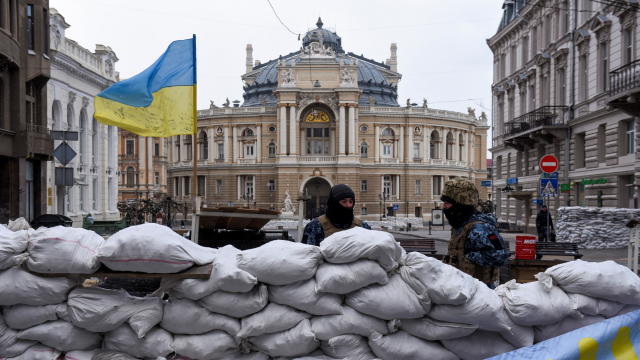 Soldiers stand guard behind a barricade, with the Odessa National Academic Opera and Ballet Theatre seen in the background, amid Russia's invasion of Ukraine, in Odessa 