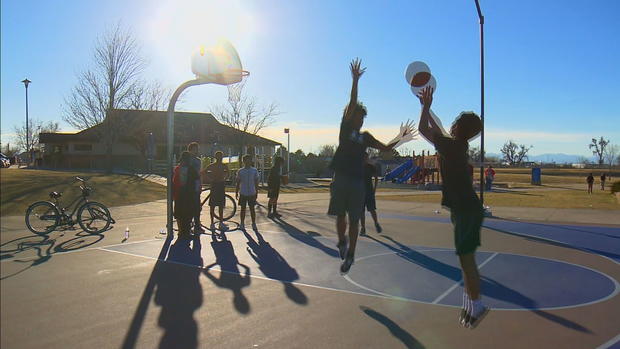 aurora teens play basketball 