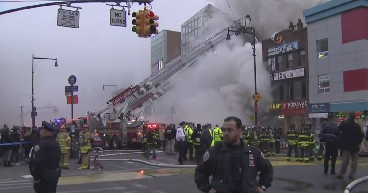 Dozens of businesses damaged by massive fire in Flushing, Queens CBS