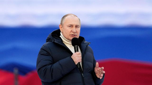 Russian President Vladimir Putin attends a concert marking the eighth anniversary of Russia's annexation of Crimea in Moscow 