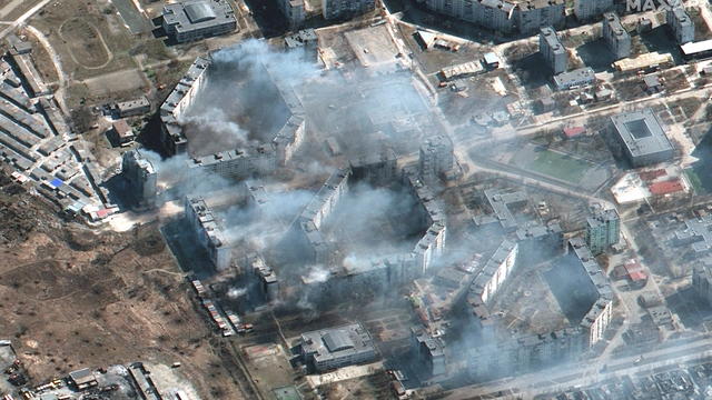 A satellite image shows burning apartment buildings in Mariupol 