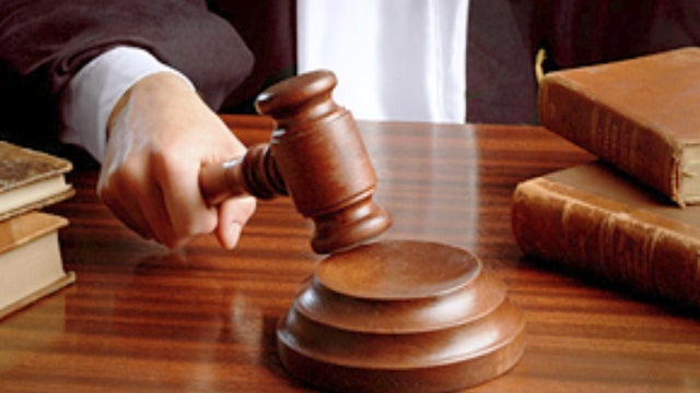 Judge's gavel on a wooden table - Close up 