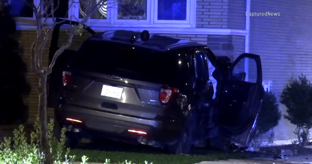 Chicago Police squad car crashes into home after collision with ...