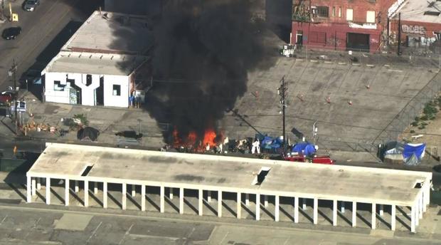 Fire erupts at downtown LA homeless encampment 