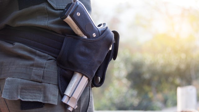 Police officer, with gun belt. 