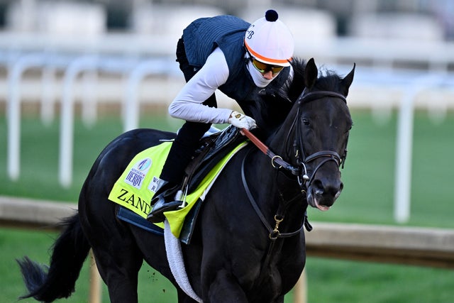 An exercise rider works Kentucky Derby morning-line favorite Zandon during morning workouts at Churchill Downs in Louisville, Kentucky, May 5, 2022. 