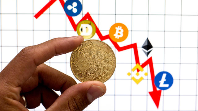 In this photo illustration, a Cryptocurrency is seen with 