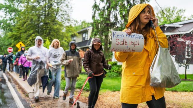 CHEVY CHASE, MD- MAY 07: Lacie Wooten-Holway walks with other a 