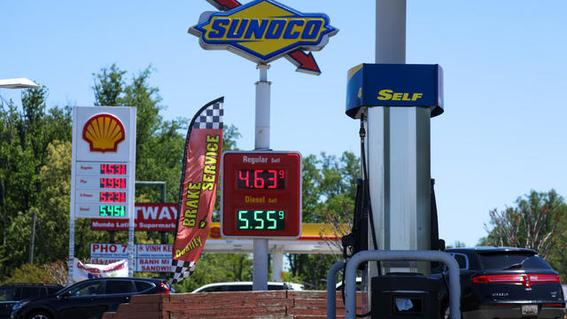 Gas prices on a board next to highway 