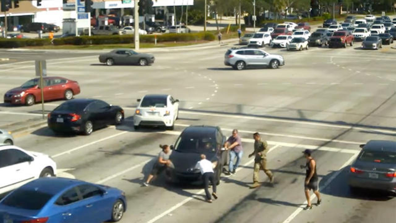 Video shows strangers jump out of their cars to help driver who lost control during a medical episode