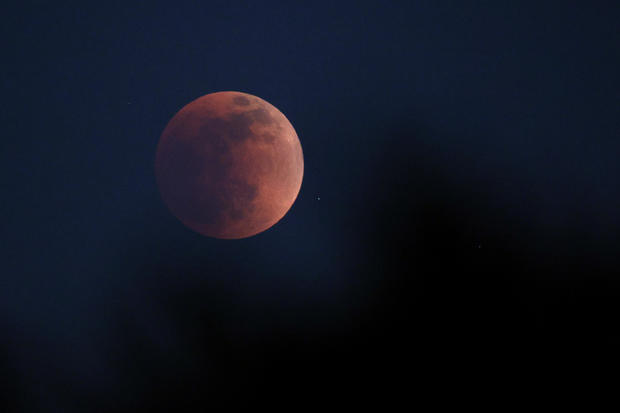 "Super flower blood moon" over Huntington Beach 