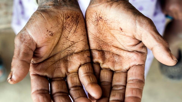 Woman cupping palms, close-up 