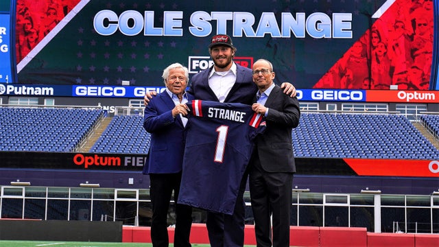 Cole Strange with Robert and Jonathan Kraft 