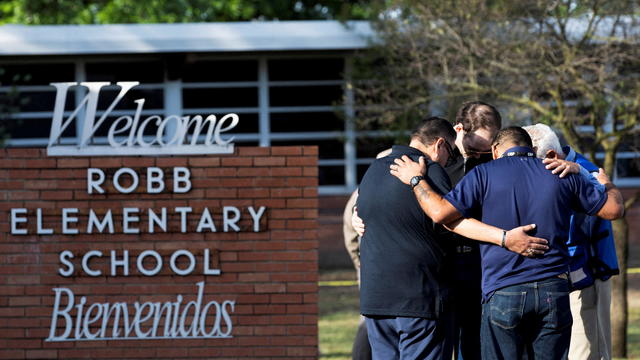 People react after a mass shooting at Robb Elementary School in Uvalde 