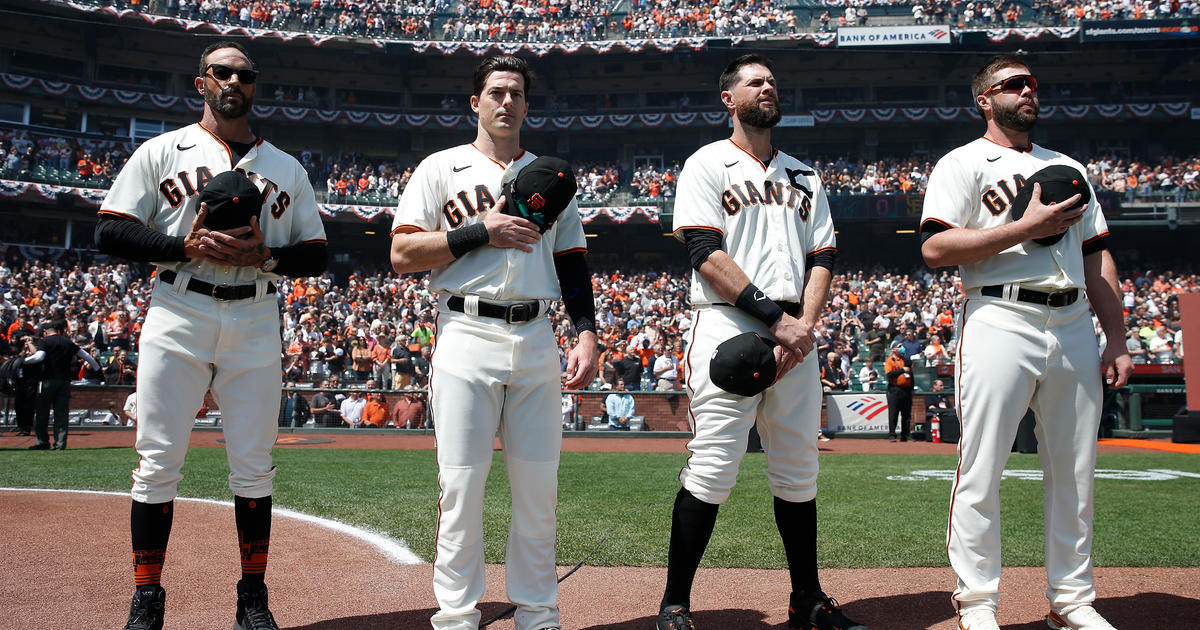 San Francisco Giants manager won't stand for anthem following mass